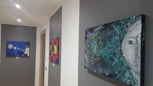 a painting hanging on a wall in a room at La Dimora Degli Artisti in Catanzaro