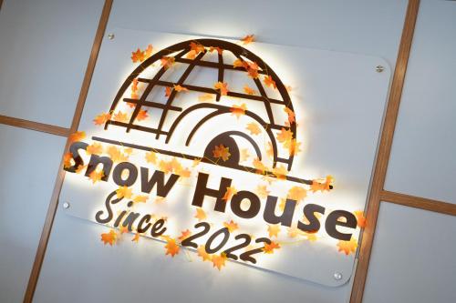 a sign for a show house with aow house sign at SNOW HOUSE Buriram in Buriram