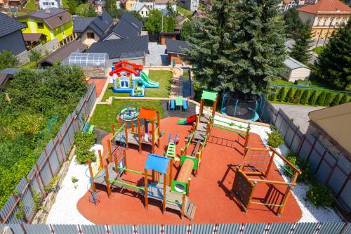 an aerial view of a park with a playground at Wellness Vila Žakovce s bazénom in Veľká Lomnica