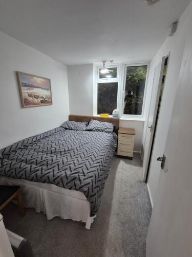 a bedroom with a bed and a window at Westcliffe chalets channel view in Niton