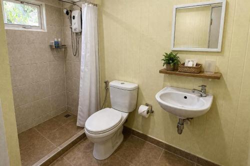 a bathroom with a toilet and a sink at Phetmanee Resort in Ko Yao Noi