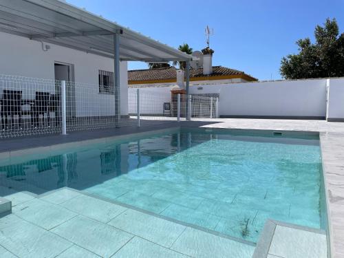 a swimming pool in front of a house at Casa Miamar I in Campano
