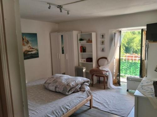 a bedroom with a bed and a window at Monolocali Tra Rieti e Terminillo e lago del Salto in Terminillo