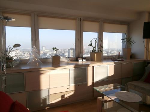 a living room with a view of a city at Alma Apartments in Warsaw