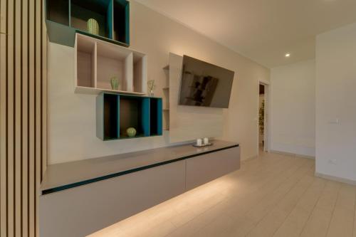 a living room with green and white walls at Luxury Liam Villa with Pool and Sea View - Goelba in Portoferraio