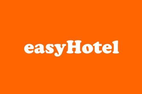 an orange sign with the word exotica on it at easyHotel Zürich City Centre in Zurich