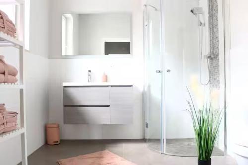 a white bathroom with a sink and a shower at Stilapartment Loft #Whirlpool saisonal in Wernigerode