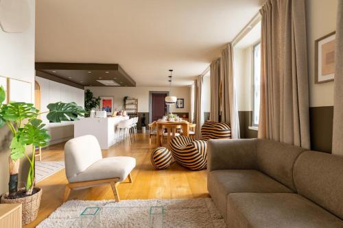 a living room with a couch and a table at Copenhagen Collection King's Garden Stay in Copenhagen