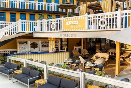 a view of the lobby of a hotel with chairs and tables at Molitor Hotel & Spa Paris - MGallery Collection in Paris