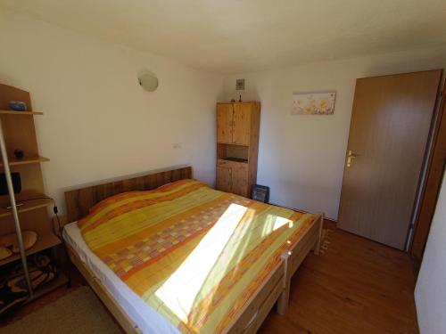 a bedroom with a large bed in a room at Vlasic Relax in Vlasic
