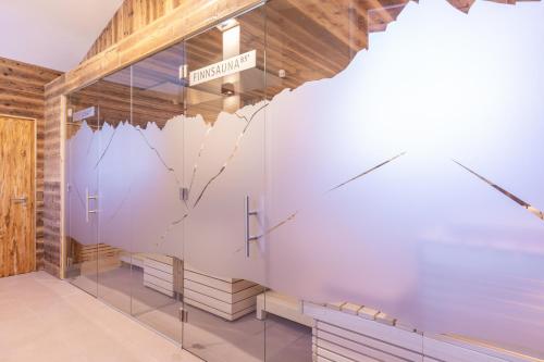 a store window with a sign that reads heartbeat at Bergidyll & Hotel Trofana in Leutasch