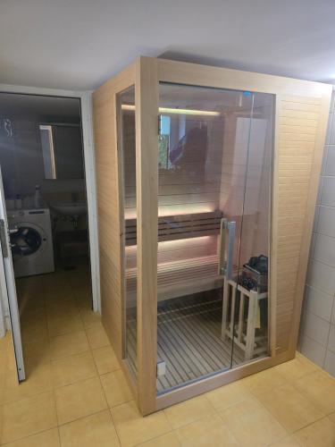 a glass shower in a bathroom with a toilet at Vlaškovec Experience in Plešivica