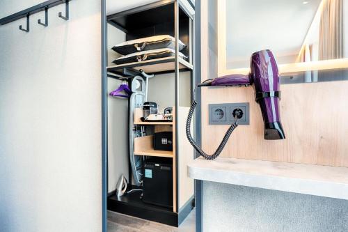 a corded phone sitting on a counter in a room at Premier Inn Berlin City Centre in Berlin