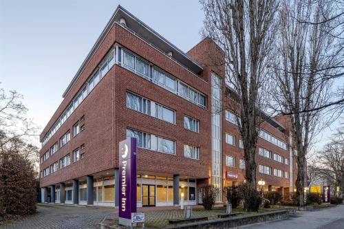 a brick building with a sign in front of it at Premier Inn Berlin City Süd in Berlin