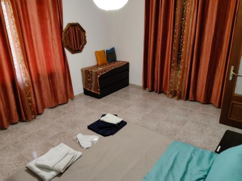 a bedroom with a bed with two towels on it at Casa Jesus - suite home in Almese