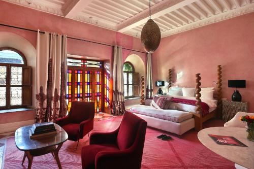 a living room with a couch and a table at El Fenn in Marrakesh