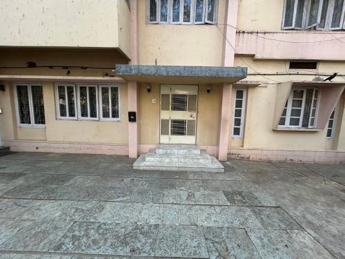an entrance to a building with a white door at Leos Inn in Pune