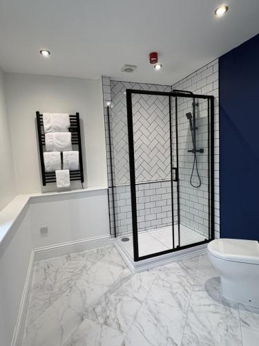 a bathroom with a shower and a toilet at Best Western Ebbw Vale in Ebbw Vale