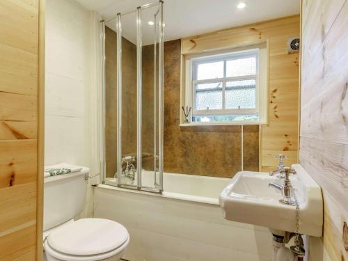 a bathroom with a toilet and a sink and a window at 2 Bed in Cupar oc-78228 in Ceres