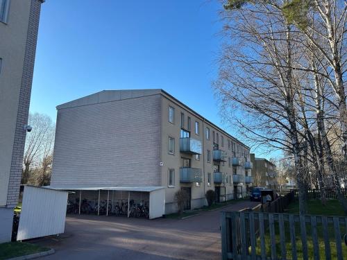 a large building with a lot of windows on a street at Klintvägen 18 E 31 in Mariehamn