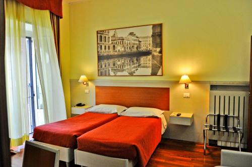 Postel nebo postele na pokoji v ubytování Hotel Rio
