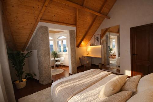 a bedroom with a bed and a desk in a room at VILLA PANGEA - Guest House - Camino del Norte in Castro-Urdiales