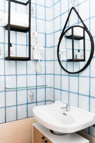 a bathroom with a sink and a mirror at Casa Marzoa in Finisterre