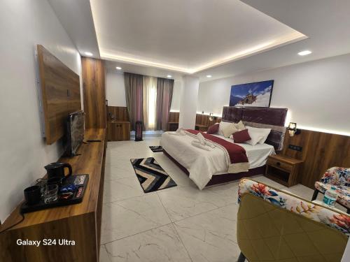 a hotel room with a bed and a television at Hotel Royal Badri - A Pilgrim's Habitat in Badrinath