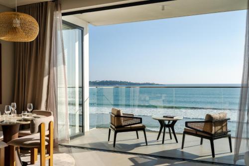 a dining room with a view of the ocean at Southbeach Weligama in Weligama