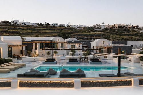 a view of a hotel with a swimming pool at Abrazo Villas in Imerovigli