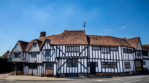 an old black and white building on a street at Best Western The Rose & Crown Hotel in Colchester