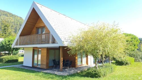 a small house with a gambrel roof at Apartma Pikabooth Terme Topolšica in Topolšica