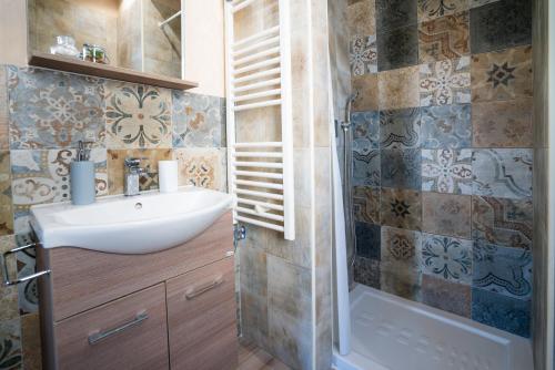 a bathroom with a sink and a shower at Casa Immacolata in Polignano a Mare