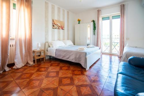 a bedroom with a bed and a tiled floor at Casa Immacolata in Polignano a Mare