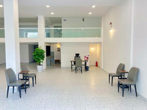 a room with chairs and a table in a building at A Z Hotel Phnom Penh in Phnom Penh