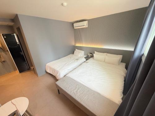 Llit o llits en una habitació de Flex 9 Hotel