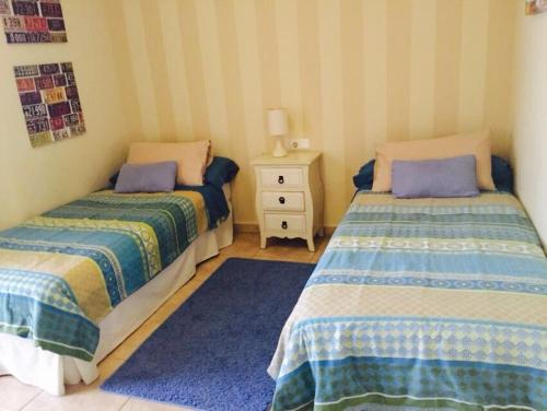 Ένα ή περισσότερα κρεβάτια σε δωμάτιο στο Casa Paraiso