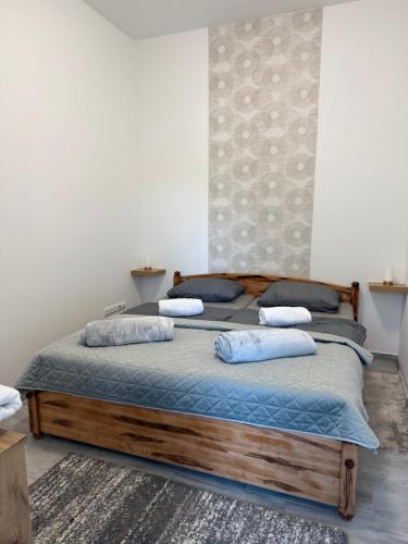 a bedroom with two beds with pillows on them at ILK Residence in Balatonalmádi