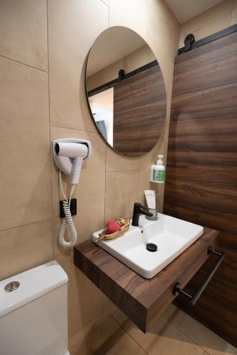 a bathroom with a sink and a mirror at Don Carlos in Paguera