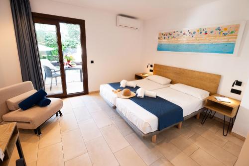 a bedroom with a bed and a table and a chair at Don Carlos in Paguera