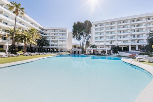 a large swimming pool in front of a building at Hotel Jaime I in Salou