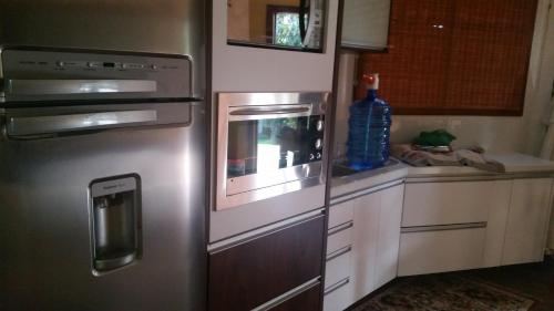Nhà bếp/bếp nhỏ tại Casa da Márcia - Guarda do Embaú