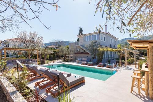 an image of a house with a swimming pool at Artemis' Garden in Skopelos Town