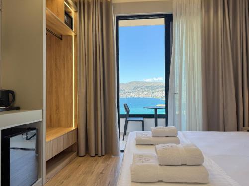 a hotel room with a view of the ocean at Erdeti Boutique Hotel in Sarandë