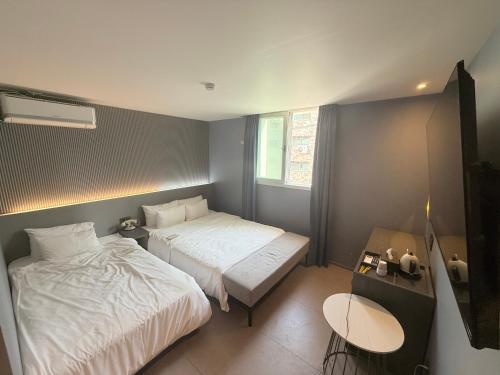Llit o llits en una habitació de Flex 9 Hotel