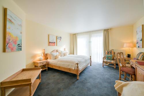 Giường trong phòng chung tại Hotel Lessing