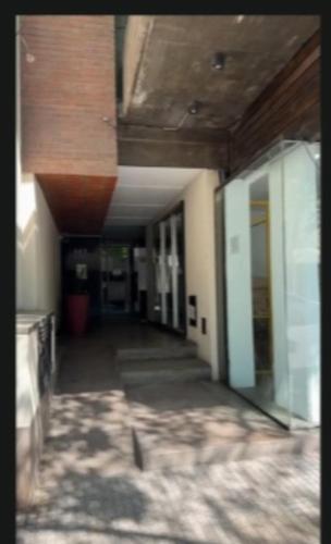 an empty hallway of a building with a ceiling at Altos de Barrio Sur in San Miguel de Tucumán
