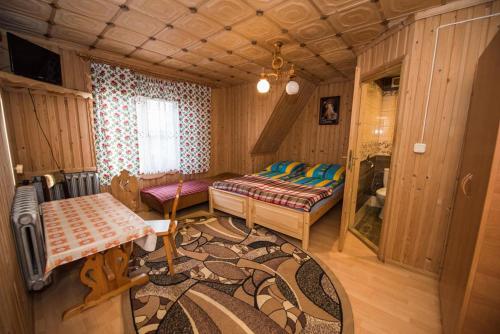 En eller flere senger på et rom på Wolne pokoje Maria Rzadkosz