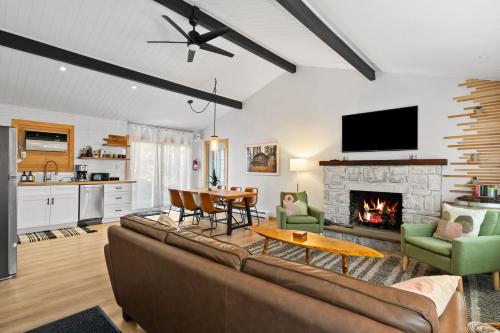 a living room with a couch and a fireplace at Firepit Game Room Seclusion and More in Locust Lakes Village