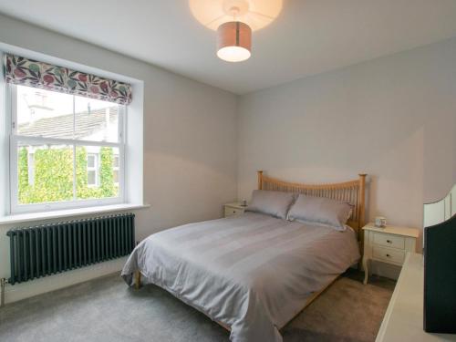 a bedroom with a bed and a window at 2 Bed in Skipton oc-75646 in Grassington